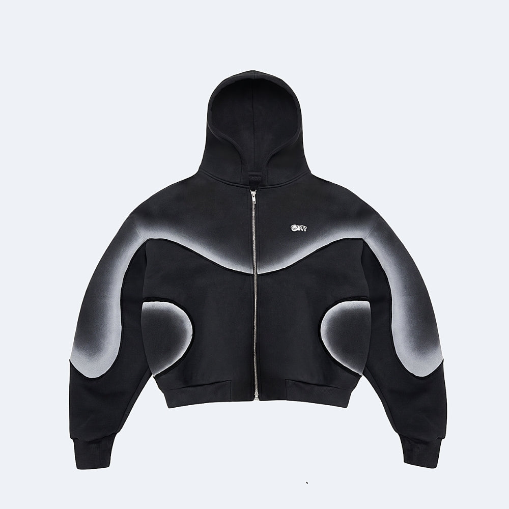 A black cropped zip-up hoodie with a white-to-gray gradient abstract graphic pattern across the shoulders, sleeves, and lower torso, featuring a small white 'GK' logo on the left chest, shown against a light gray background.