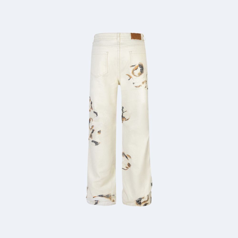 Off-white wide-leg jeans with brown and black tiger print details on the legs, shown from the back against a light gray background.