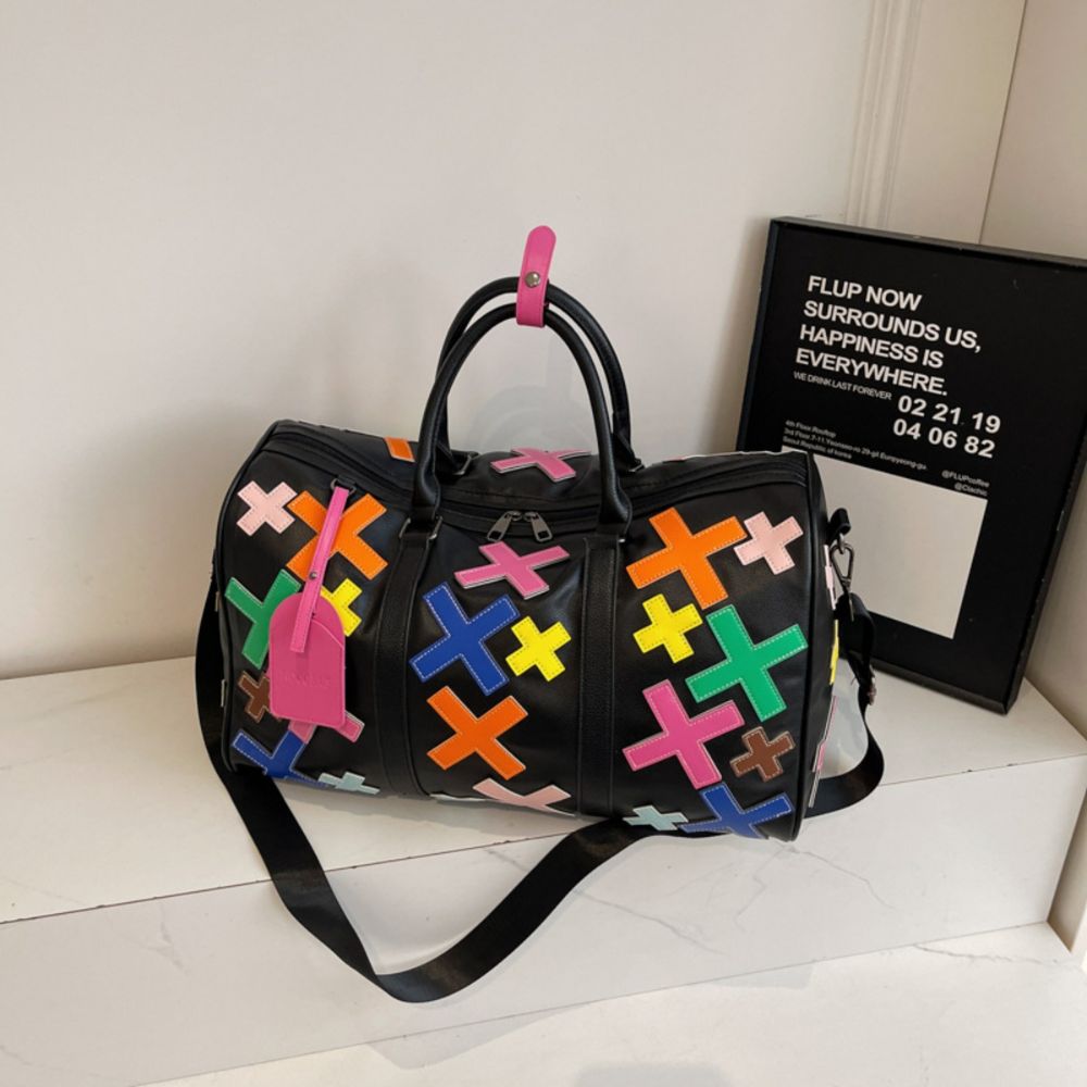 Multicolor. KRUX Crossover duffle bag with colorful geometric X patterns, product view