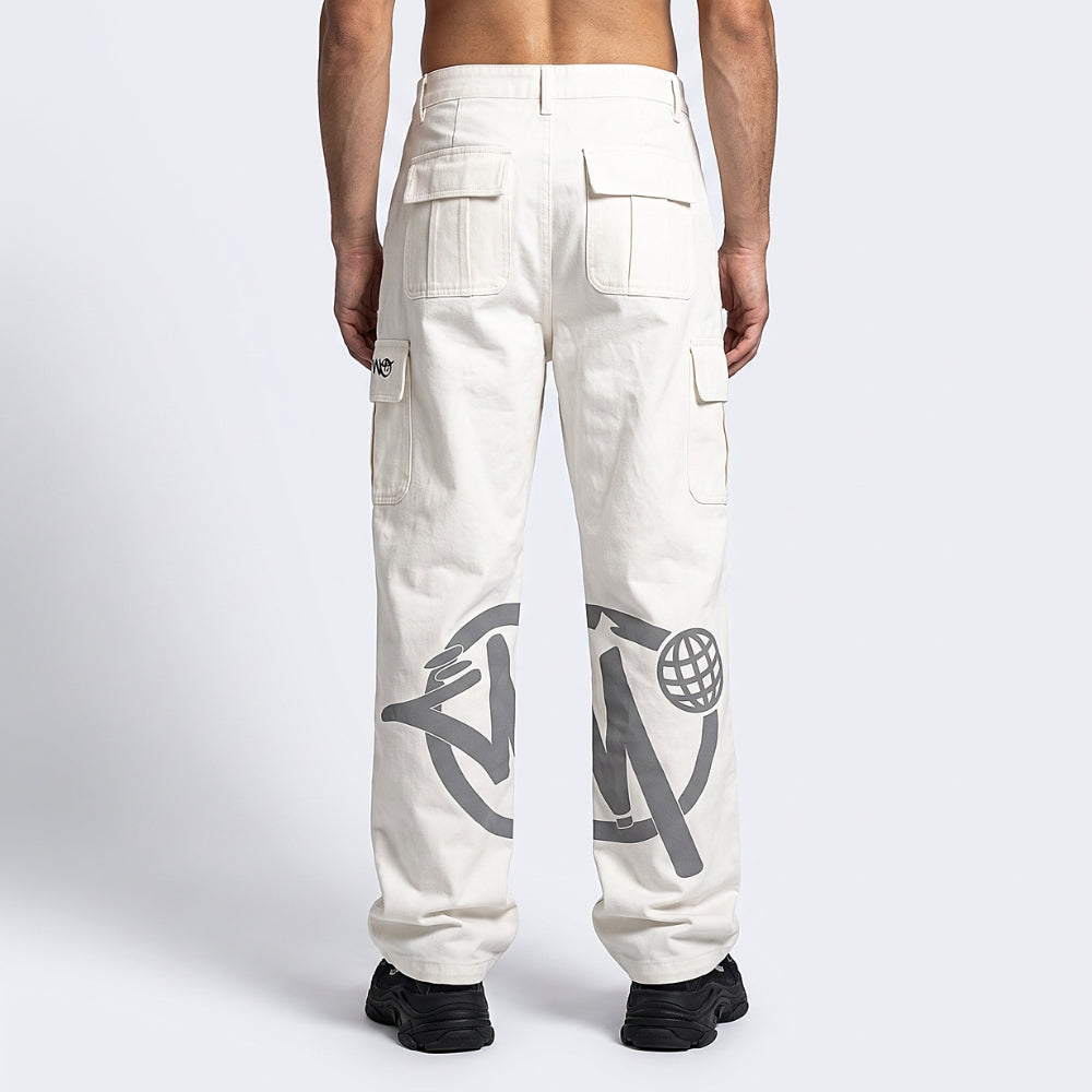 A model shown from the back wearing off-white cargo pants with large gray graphic prints on the lower legs, paired with black sneakers against a light gray studio background.