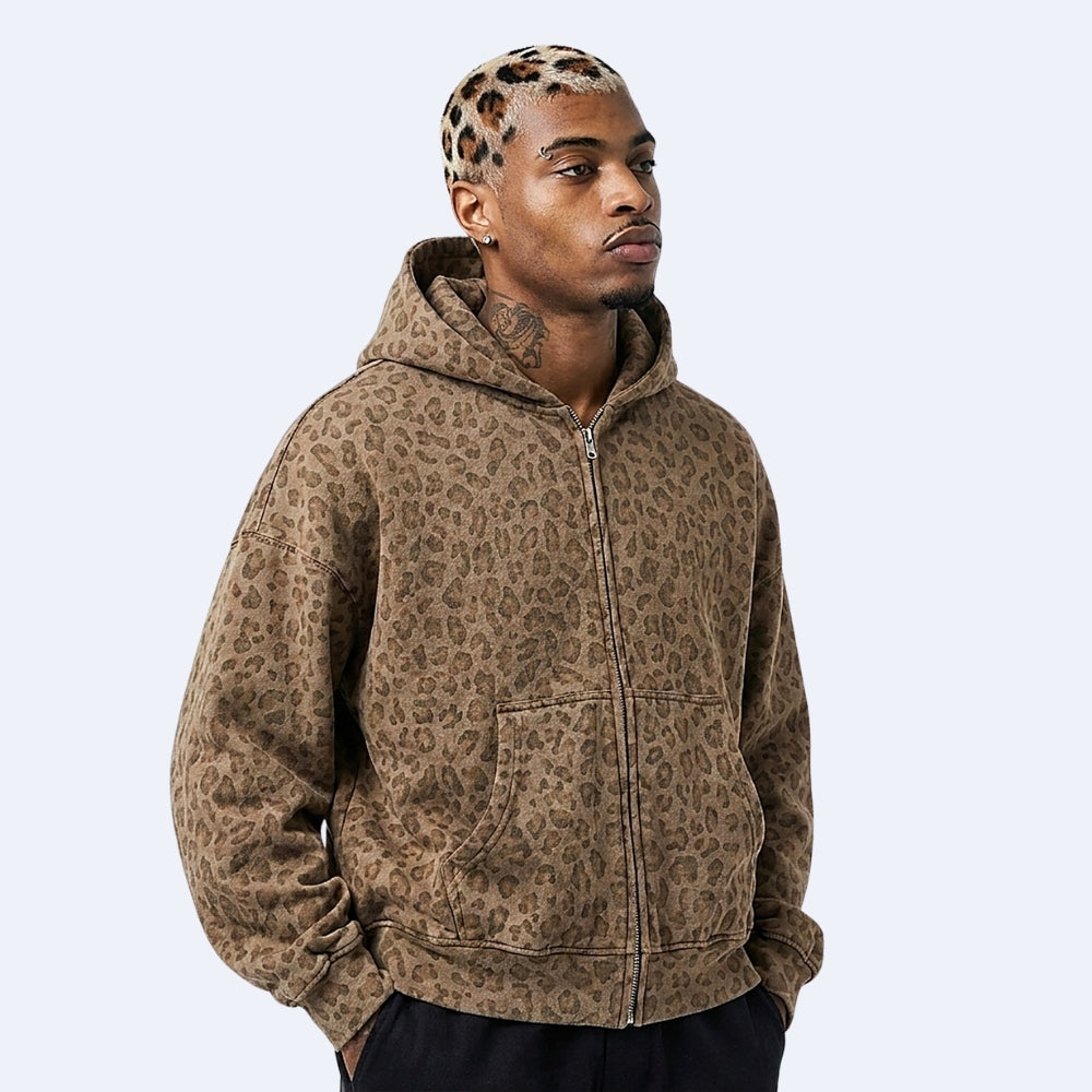 Brown. KRUX Feral leopard zip hoodie in brown, worn by a male model — front view, oversized fit