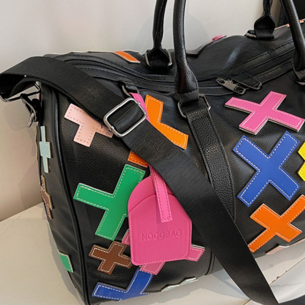 Multicolor. KRUX Crossover duffle bag in black with colorful geometric patches