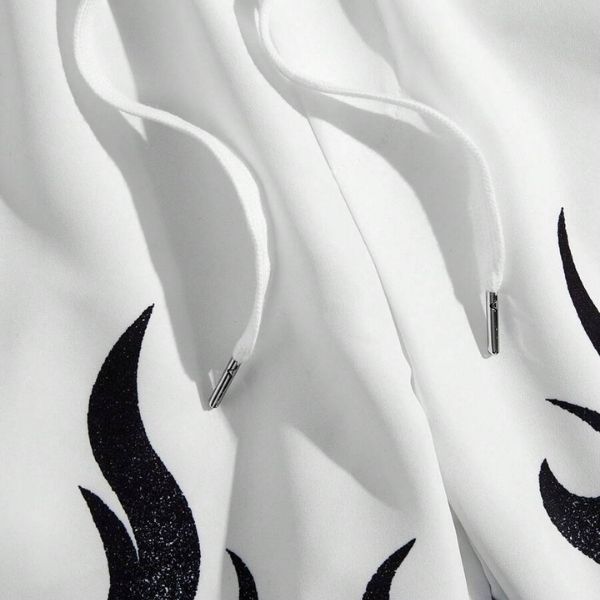 White. White fabric with black abstract flame patterns, shown against a white background.