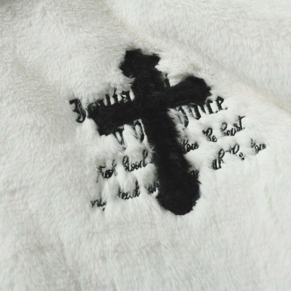 White. A black cross graphic with text on a white background.