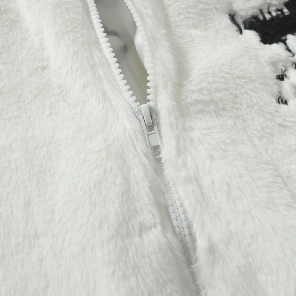 White. A close-up of a white fuzzy jacket with a zipper.