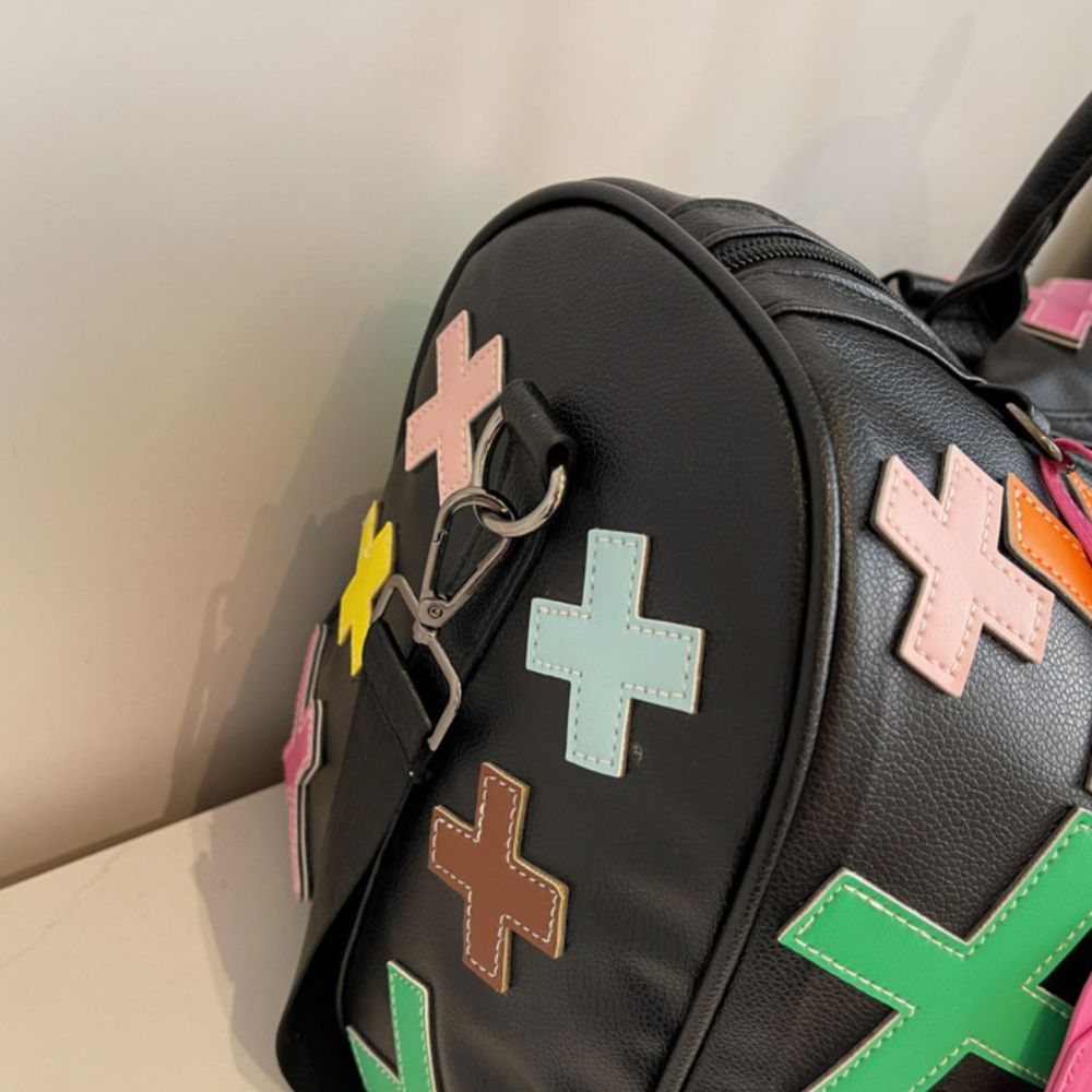 Multicolor. KRUX Crossover duffle bag with colorful cross-shaped patches, product view