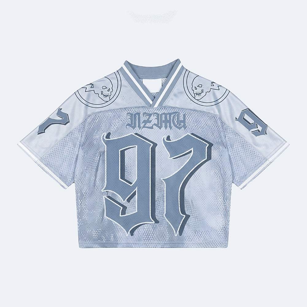 Blue. A light blue and white mesh cropped jersey with NINJA across the chest and a large 97 on the front, featuring skull graphics on the shoulders.