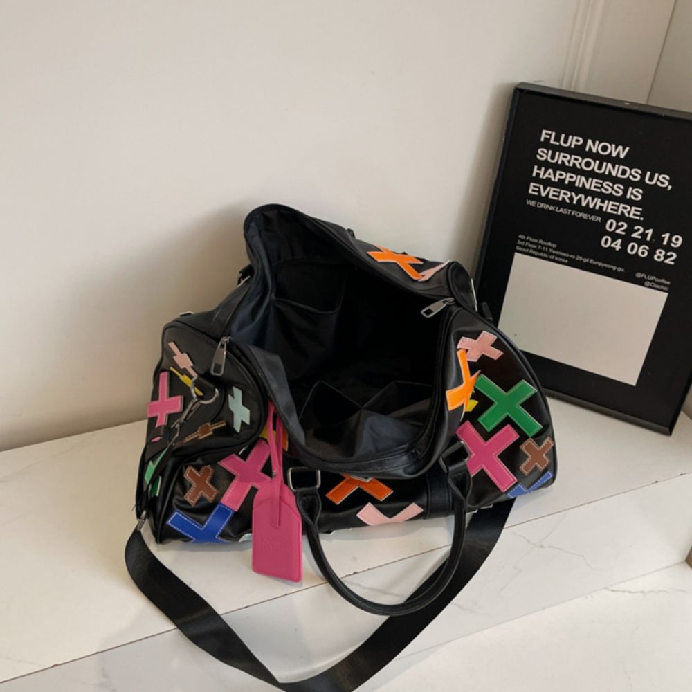 Multicolor. KRUX Crossover duffle bag with colorful X appliques, styled product shot