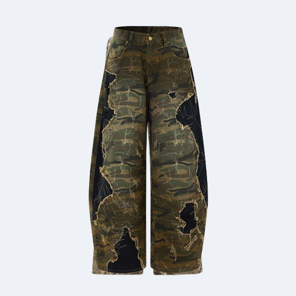 Wide-leg cropped pants featuring a distressed camouflage pattern with black ripped sections and tan outlines, shown against a light gray background.